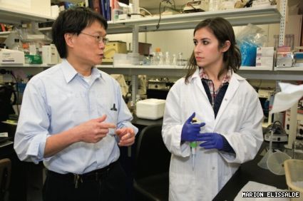 Adrian Tsang talks with Katia El Jurdi, a Science College student conducting independent research in Tsang’s lab.